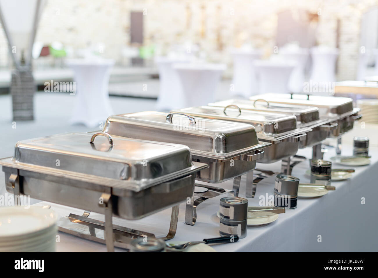 Buffet heated trays standing in line ready for service. Outdoors buffet