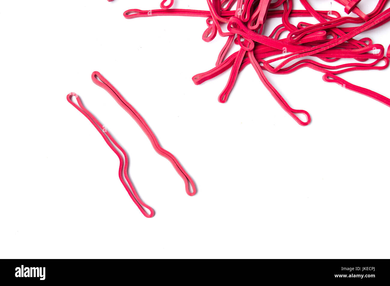 Bunch of red rubber bands isolated on white Stock Photo