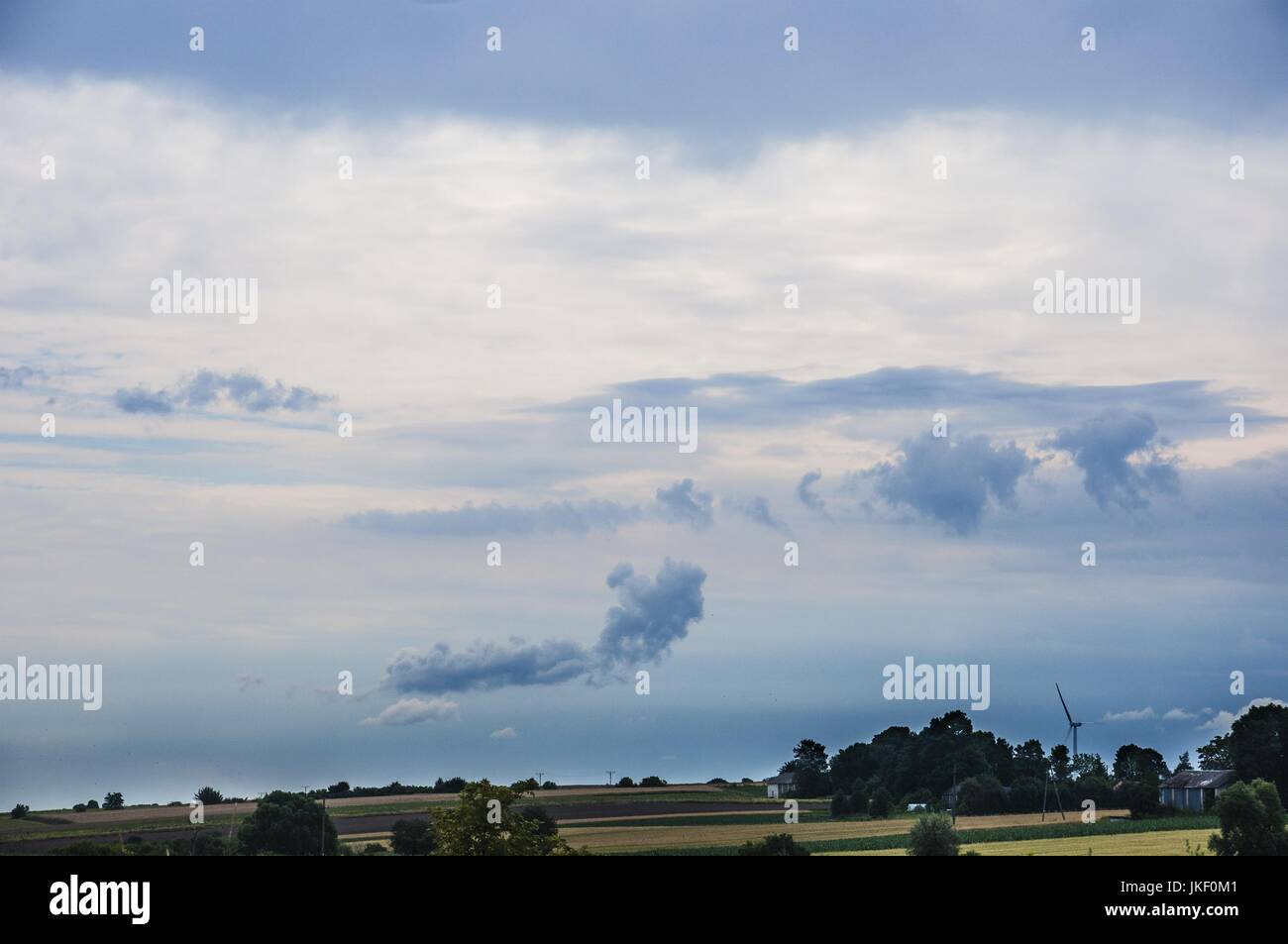 fields in the village with the blue sky and clouds Stock Photo - Alamy