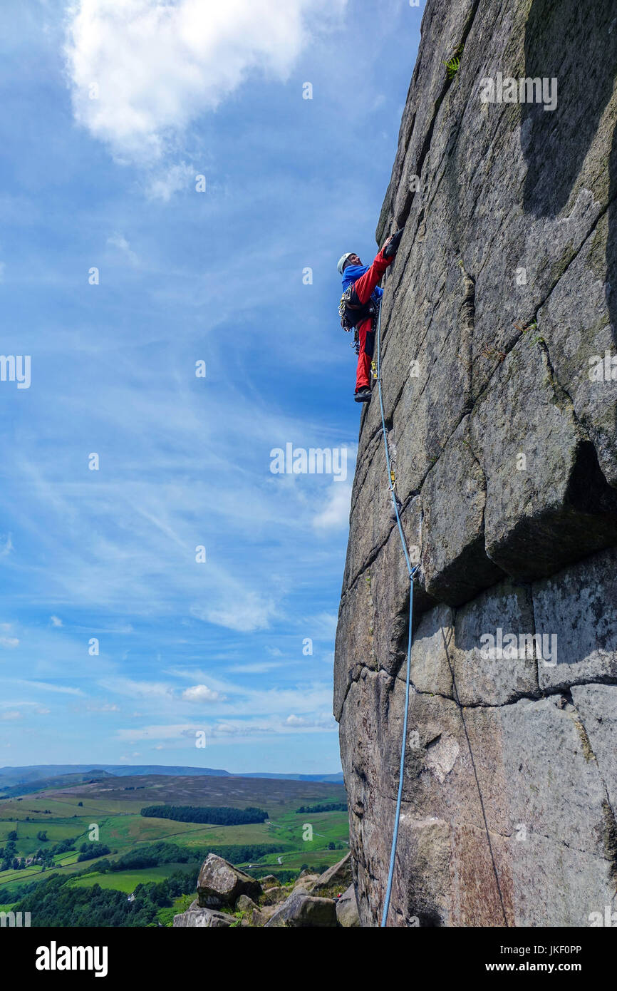 Stanage Edge Rocks Rock climber at Stanage Edge, Peak District National Park, Derbyshire ...