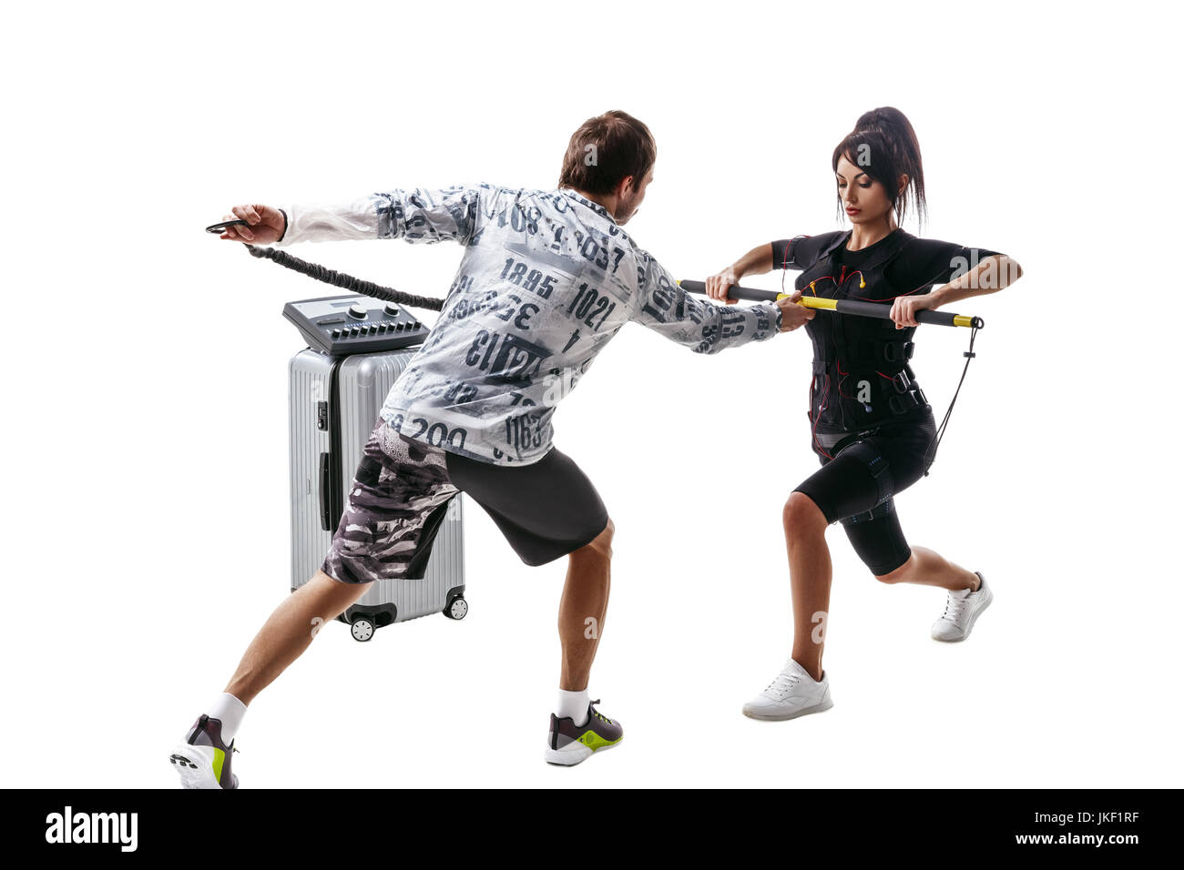 EMS fitness woman in full electrical muscular stimulation suit doing