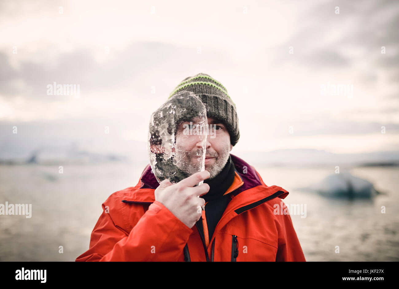 Iceland Man With A Piece Of Ice Covering Half Of His Face Stock Photo Alamy