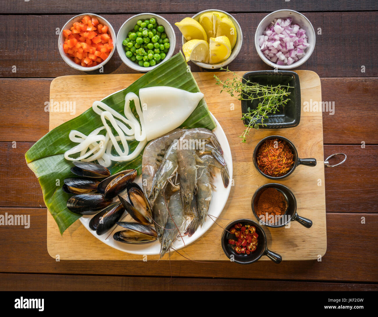 Raw seafood on plate, healthy food, prawn, clam squid. Stock Photo