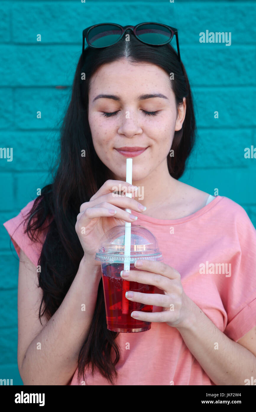 Portrait of young woman with soft drink Stock Photo