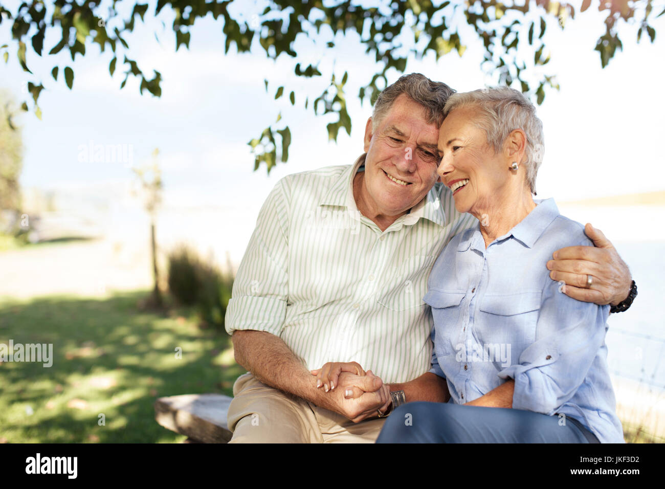 Happy senior couple in garden Stock Photo - Alamy