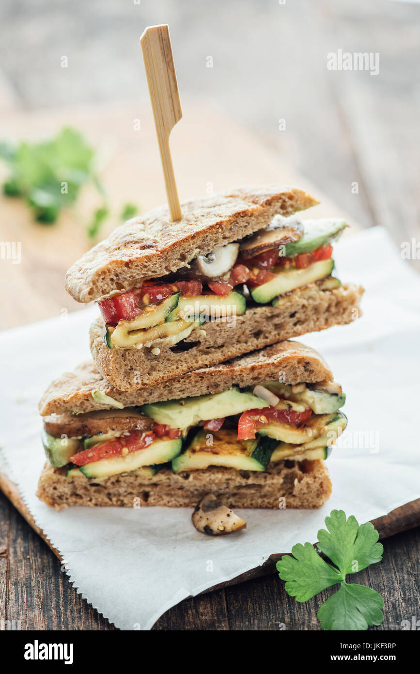 Vegetable Sandwich, grilled zucchini and mushroom, avocado,tomato, herbs, vegan Stock Photo