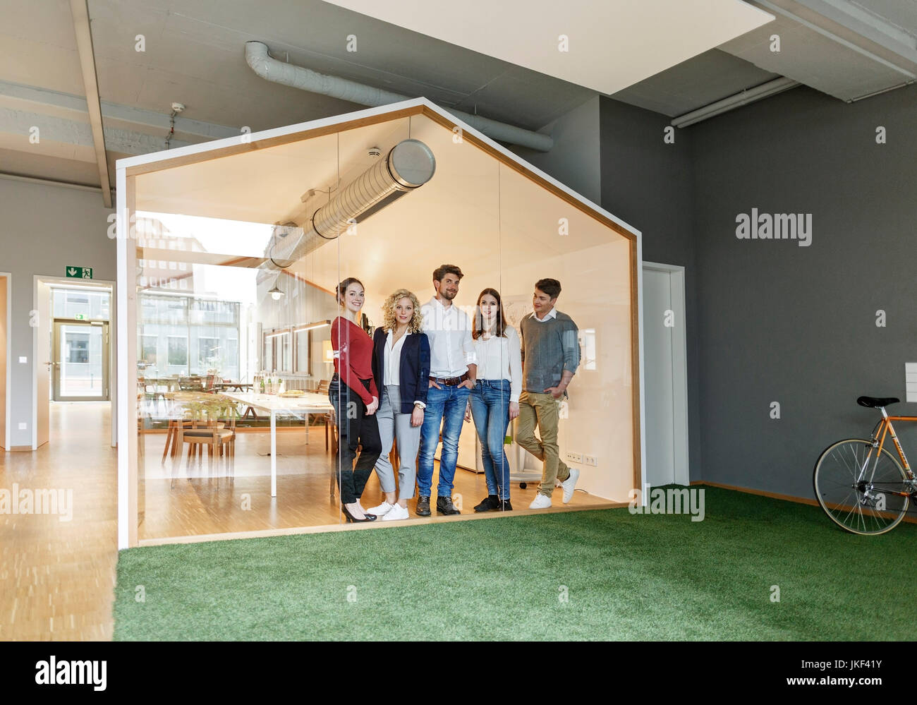 Business team standing in modern office Stock Photo - Alamy
