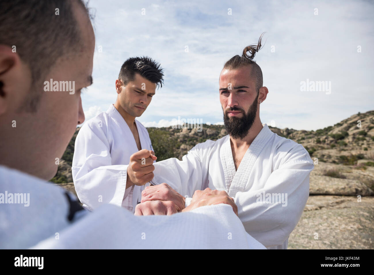 Men doing grip exercises during a martial arts training Stock Photo Alamy