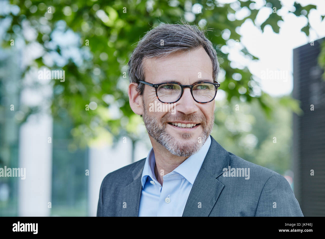 Smiling mature businessman outdoors Stock Photo - Alamy