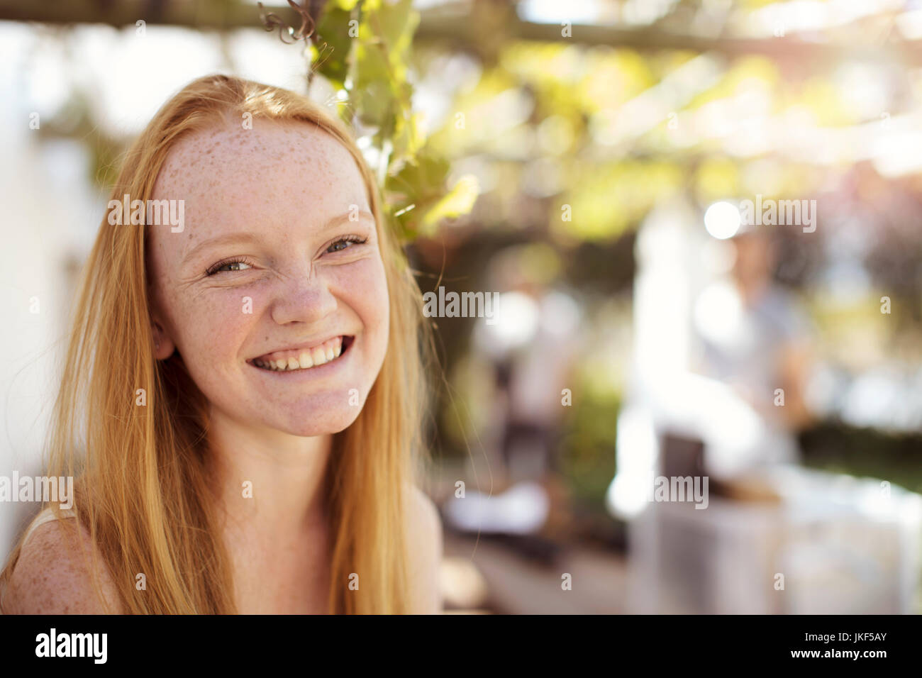 Portrait of happy girl with long red hair Stock Photo - Alamy