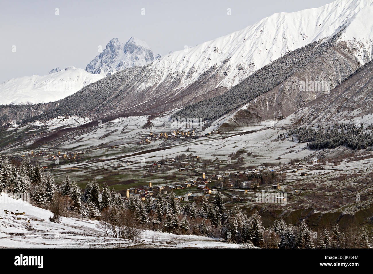 Mt Ushba, one of the peaks of the Caucasus Mountains and medieval tower villages, in Georgia. Stock Photo
