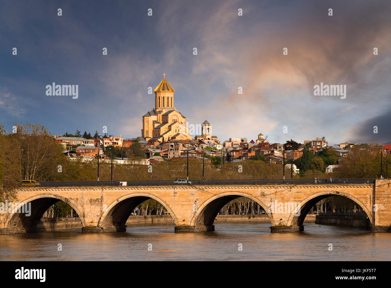 Saarbrucken bridge and Sameba Cathedral in Tbilisi, Georgia Stock Photo