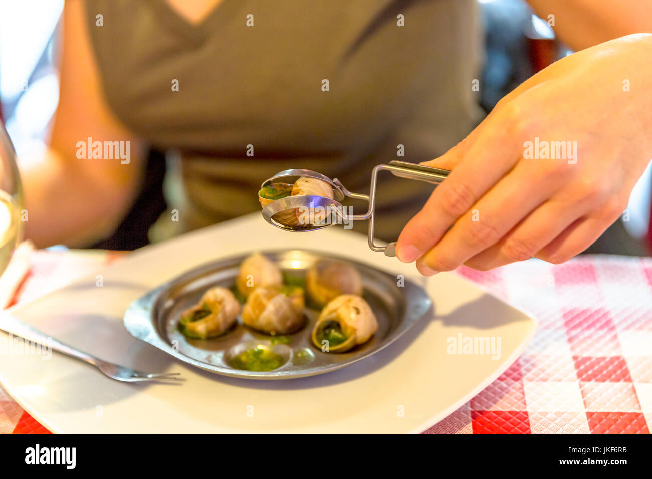 Eating snails in Paris Stock Photo