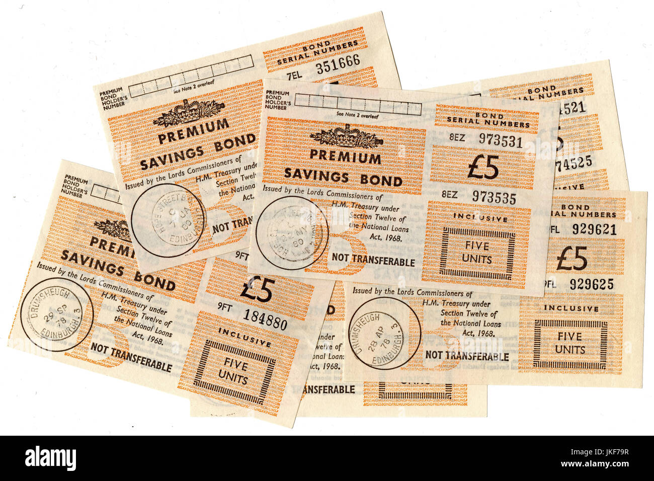 Pile of £5 premium savings bond certificates. Stock Photo