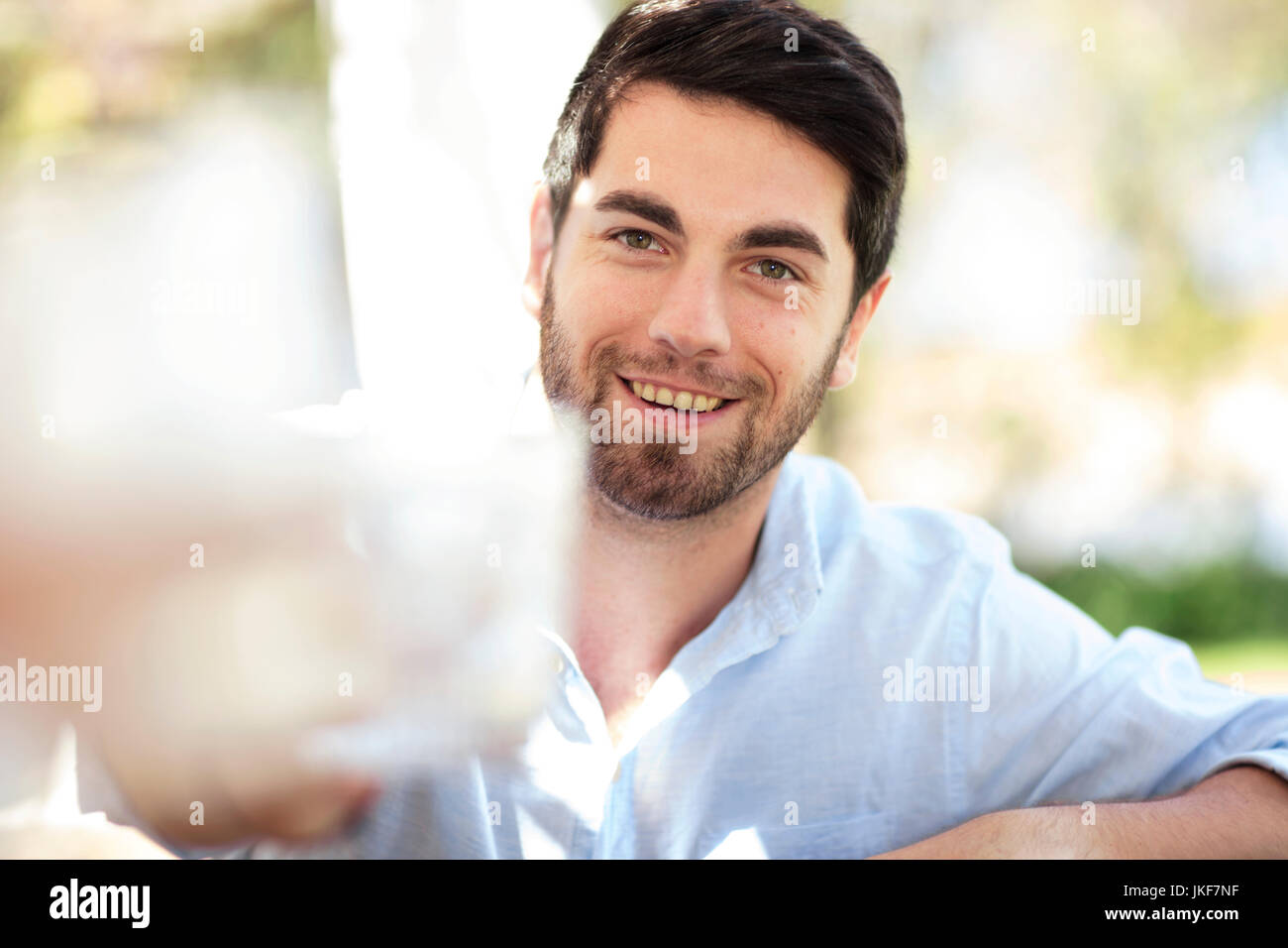 Portrait of smiling young man outdoors Stock Photo
