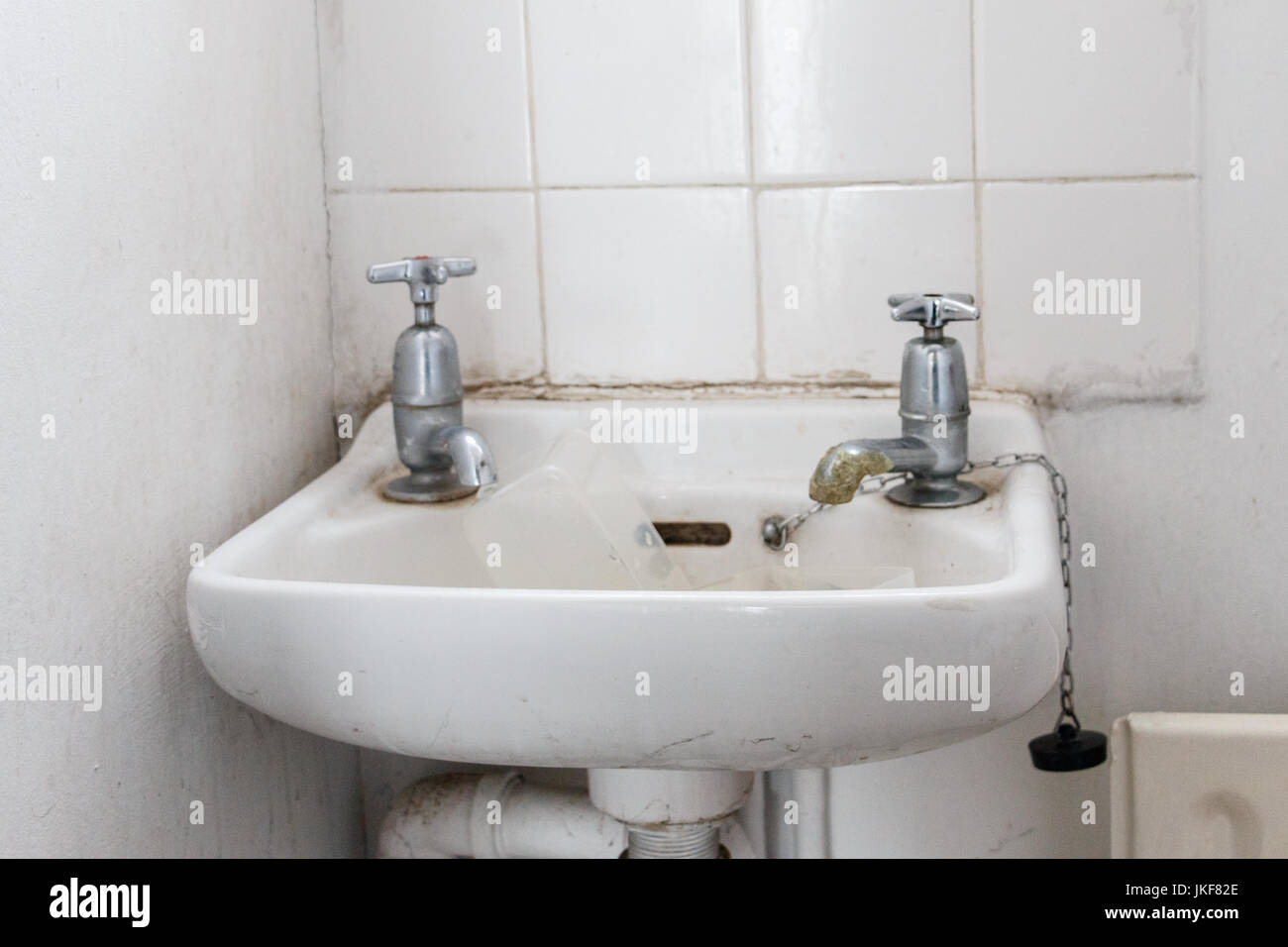 water basin with separate hot and cold water taps as used in Britain