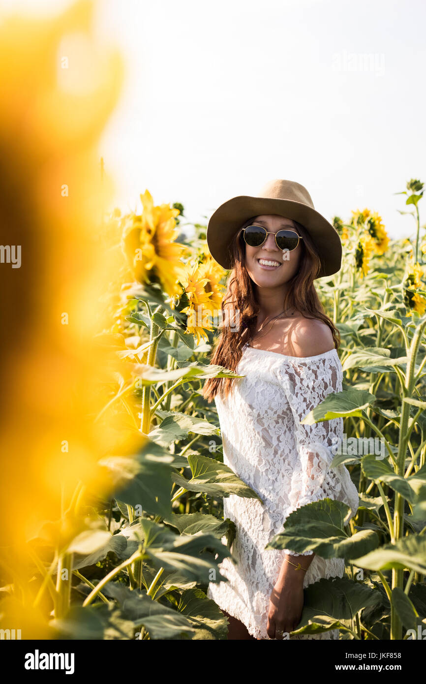 Beautiful Woman in a Sunflower Field Stock Photo - Alamy