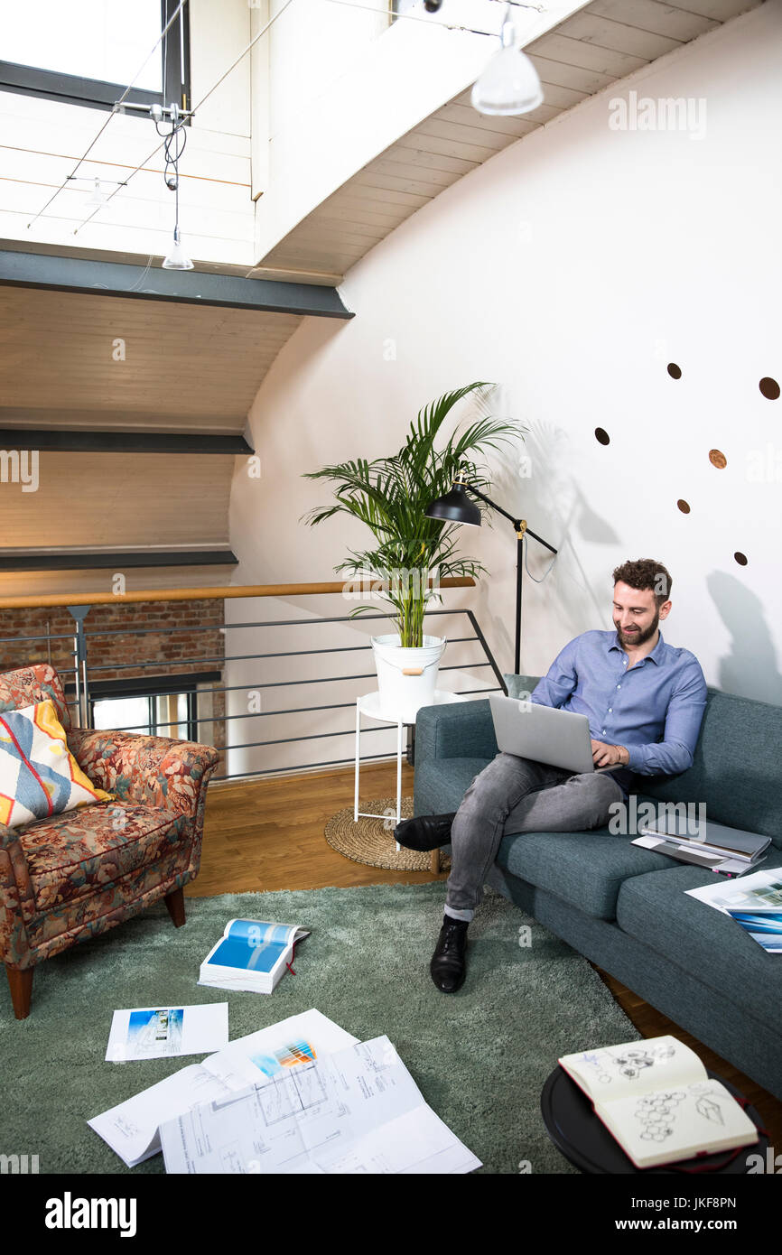 Man working on project in modern office Stock Photo - Alamy