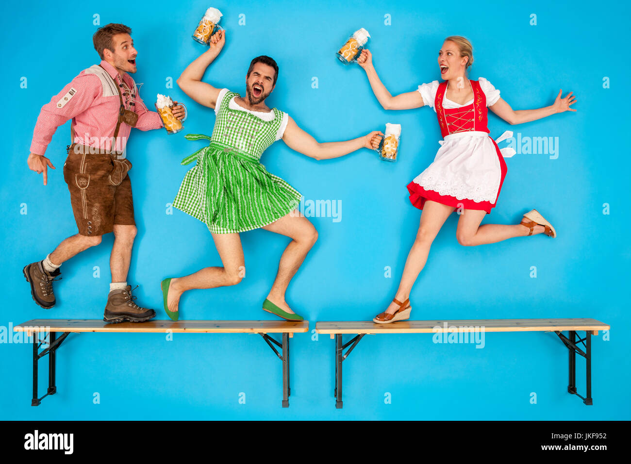 People at the Oktoberfest dancing on beer benches Stock Photo - Alamy