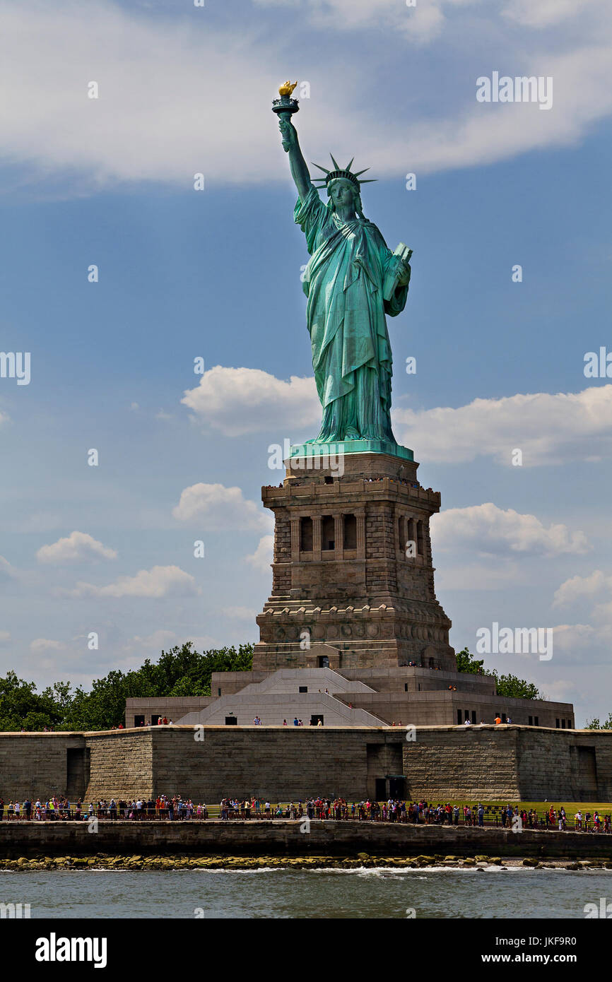 Statue of Liberty on Ellis Island, New York City, New York. Color daytime  landscape photo, statue is in center of frame, ample copy space in sky  Stock Photo - Alamy