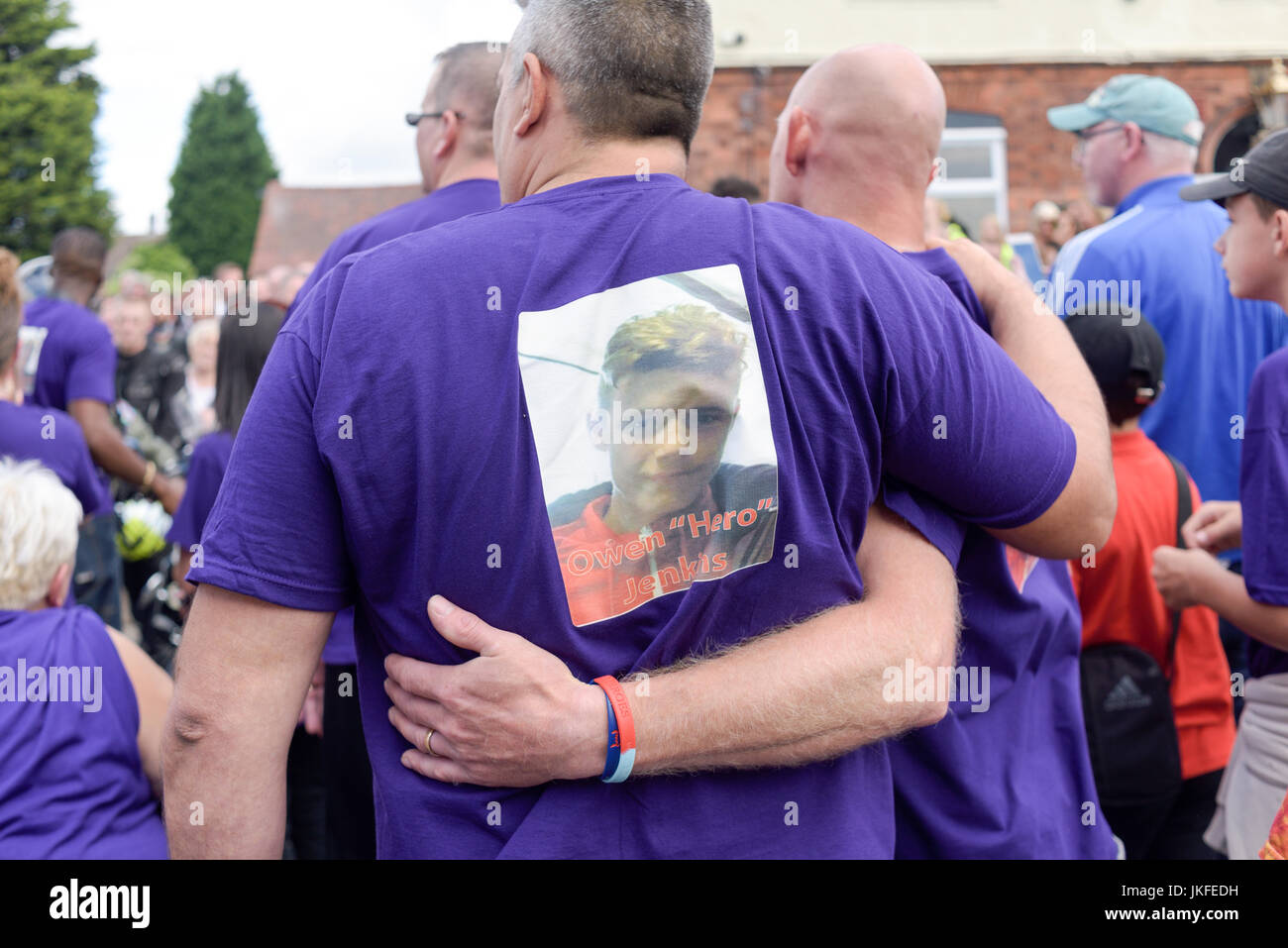 Beeston, Nottinghamshire, UK. 23rd July 2017. Nottinghamshire bikers’ group, Nottz Bikerz held a charity motorcycle run for Owen Jenkins.Owen drowned in the river Trent trying to save a young girl who was in trouble in the water.Thousands of motorcyclist turn up along with members of the public and Owens family members.Owen's family lead parade all wearing purple his favourite colour. Credit: Ian Francis/Alamy Live News Stock Photo