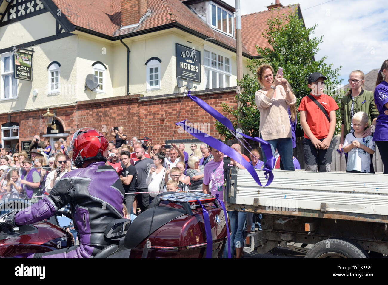 Beeston, Nottinghamshire, UK. 23rd July 2017. Nottinghamshire bikers’ group, Nottz Bikerz held a charity motorcycle run for Owen Jenkins.Owen drowned in the river Trent trying to save a young girl who was in trouble in the water.Thousands of motorcyclist turn up along with members of the public and Owens family members. Credit: Ian Francis/Alamy Live News Stock Photo