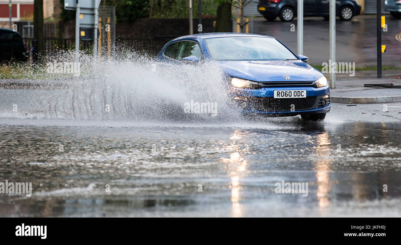 Bristol, UK. 23rd July, 2017. Drivers negotiate their way through flooded roads in the centre of Bristol. Heavy storm showers have led to flash flooding in some areas of the city. 23 July 2017 Credit: Adam Gasson/Alamy Live News Stock Photo