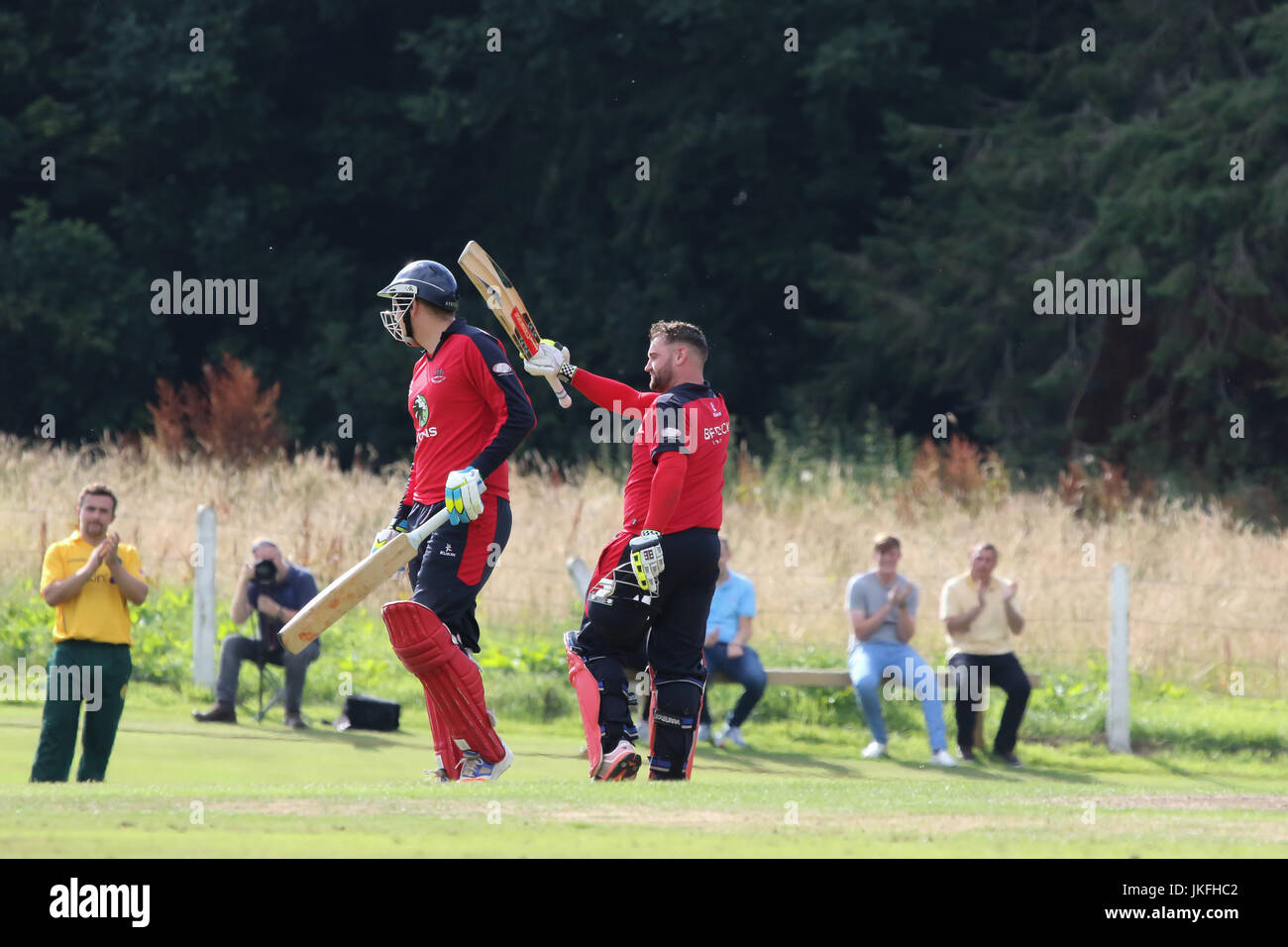 The Lawn, Waringstown, Northern Ireland, UK. 23rd July, 2017. The Lagan Valley Steels Twenty 20 Cup Final 2017. Waringstown retained the trophy with a 26 run win over North Down in today's final. James Hall (right) celebrates his century. Credit: David Hunter/Alamy Live News Stock Photo