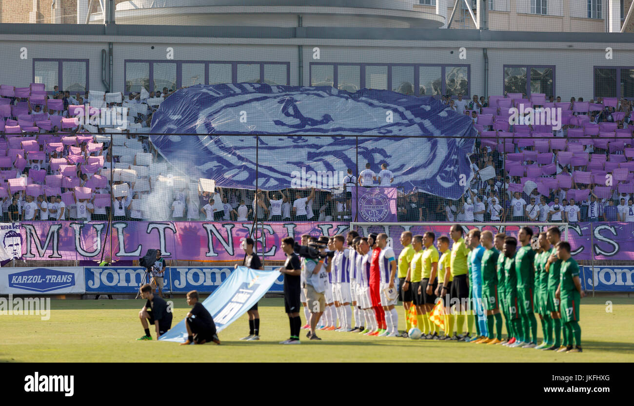 Budapest, Hungary. 23rd July, 2017. The ultras of Ujpest FC lift up the old badge of the club prior to the Hungarian OTP Bank Liga match between Ujpest FC and Ferencvarosi TC at Ferenc Szusza Stadium on July 23, 2017 in Budapest, Hungary. The club management changed the badge of the team and the fans started to protest against this decision. Credit: Laszlo Szirtesi/Alamy Live News Stock Photo