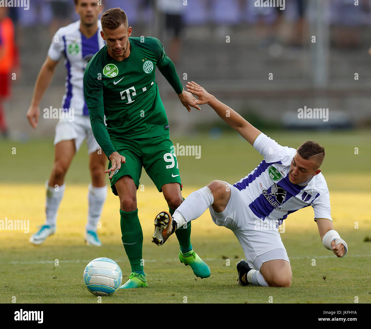 BUDAPEST, HUNGARY - JULY 12: (r-l) Roland Varga of Ferencvarosi TC hugs  goal scorer Stefan