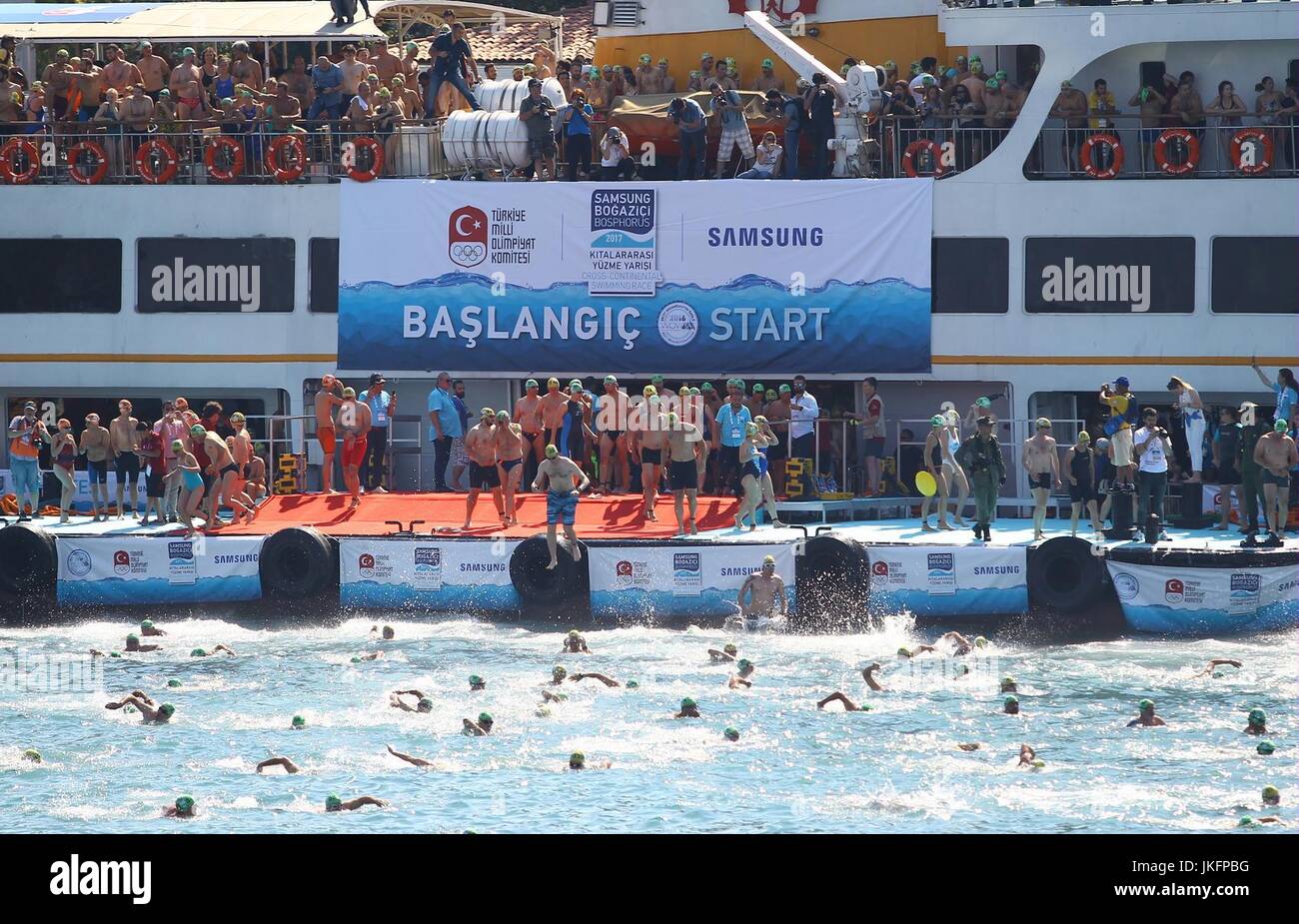 (170724) -- ISTANBUL, July 24, 2017(Xinhua) -- Swimmers dive to the water during the 29th Bosphorus Cross-Continental Swimming Race in Istanbul, Turkey, on July 23, 2017. (Xinhua) Stock Photo