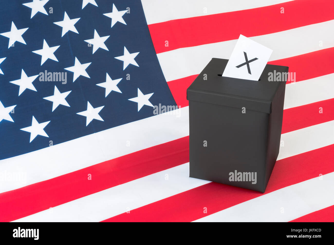 Black ballot box + American  US Stars and Stripes. US Presidential, midterm elections, US Primaries, 2024 U.S. Elections, voter turnout, election USA Stock Photo