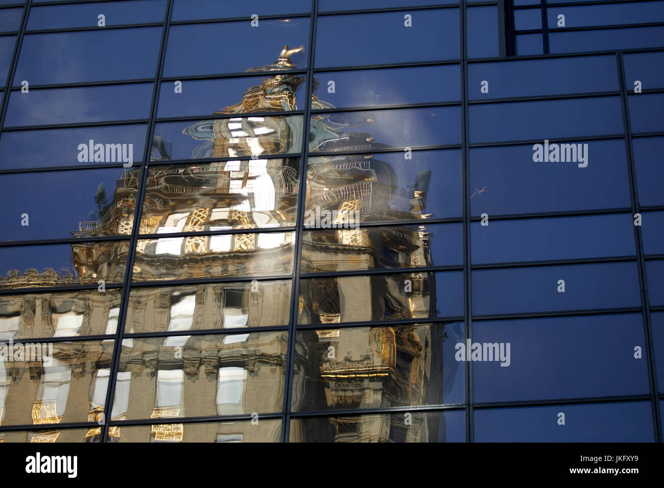 Building reflecting off Trump Tower in Manhattan, New York Stock Photo