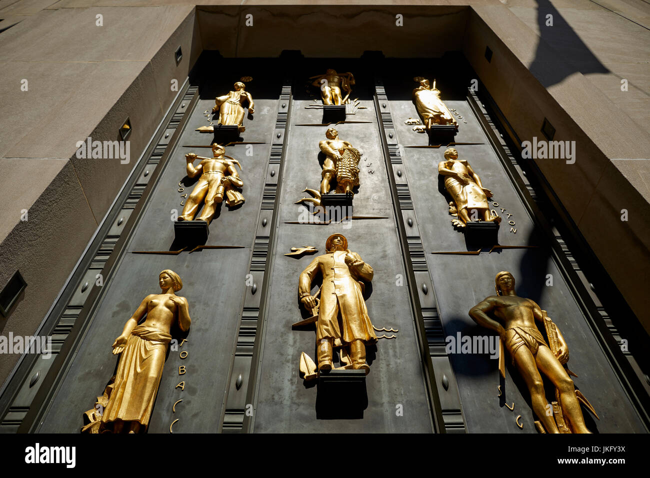 New York City, Manhattan, gold statue mural above Cole Haan entrance in the Rockefeller Center on Fifth Avenue Stock Photo