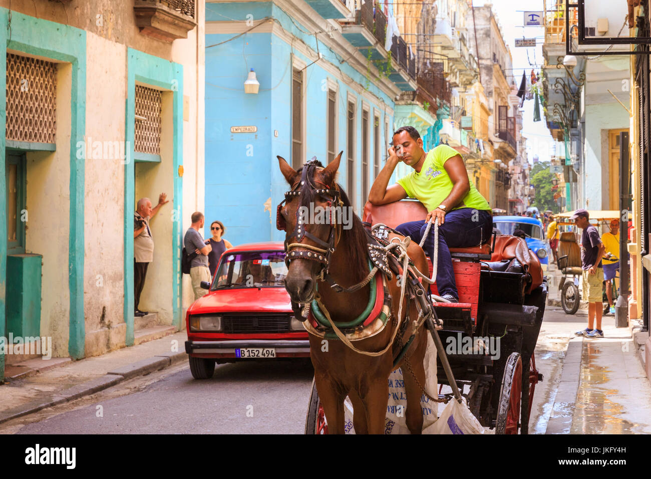 Havana street scene, horse cart driver taking a nap in the street
