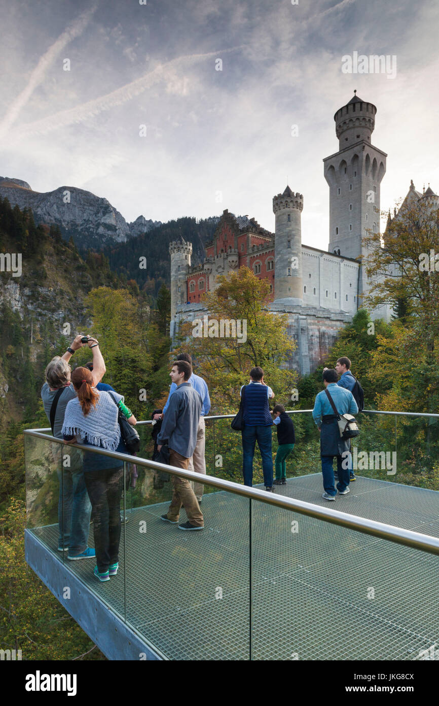 Germany, Bavaria, Hohenschwangau, Schloss Neuschwanstein castle, tourists at observation platform Stock Photo