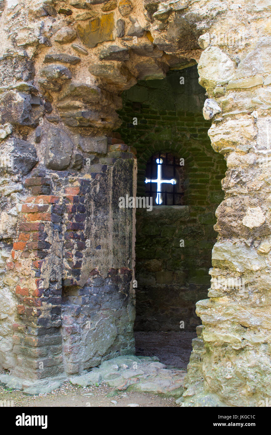 An Arrow Slit in the wall of the 13th century Titchfield Abbey in Hampshire England that was home to a monastic community many centuries ago. Stock Photo