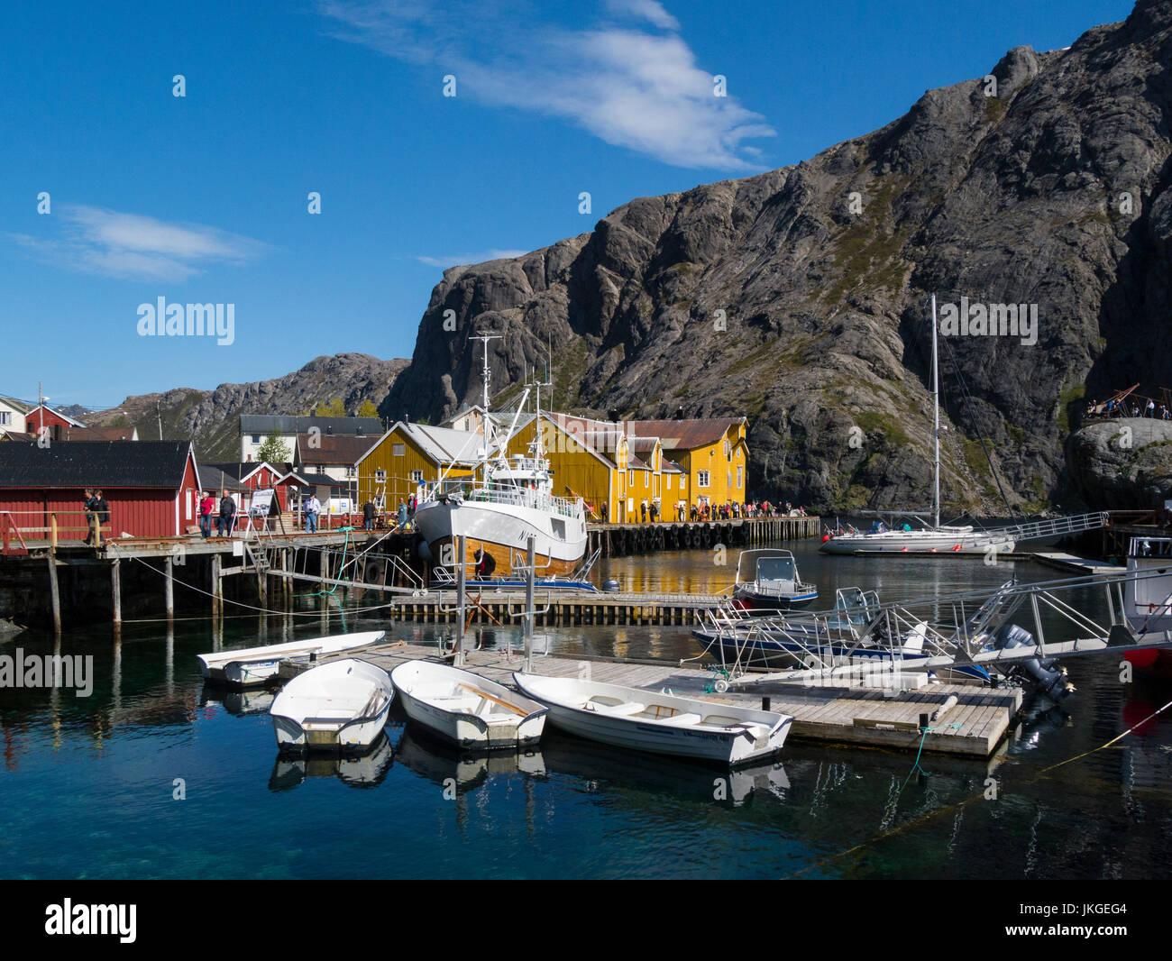 Nusfjord harbour in old preserved fishing village now a museum  Flakstadøy one of main islands of Lofoten archipelago Norway busy with visiting touris Stock Photo