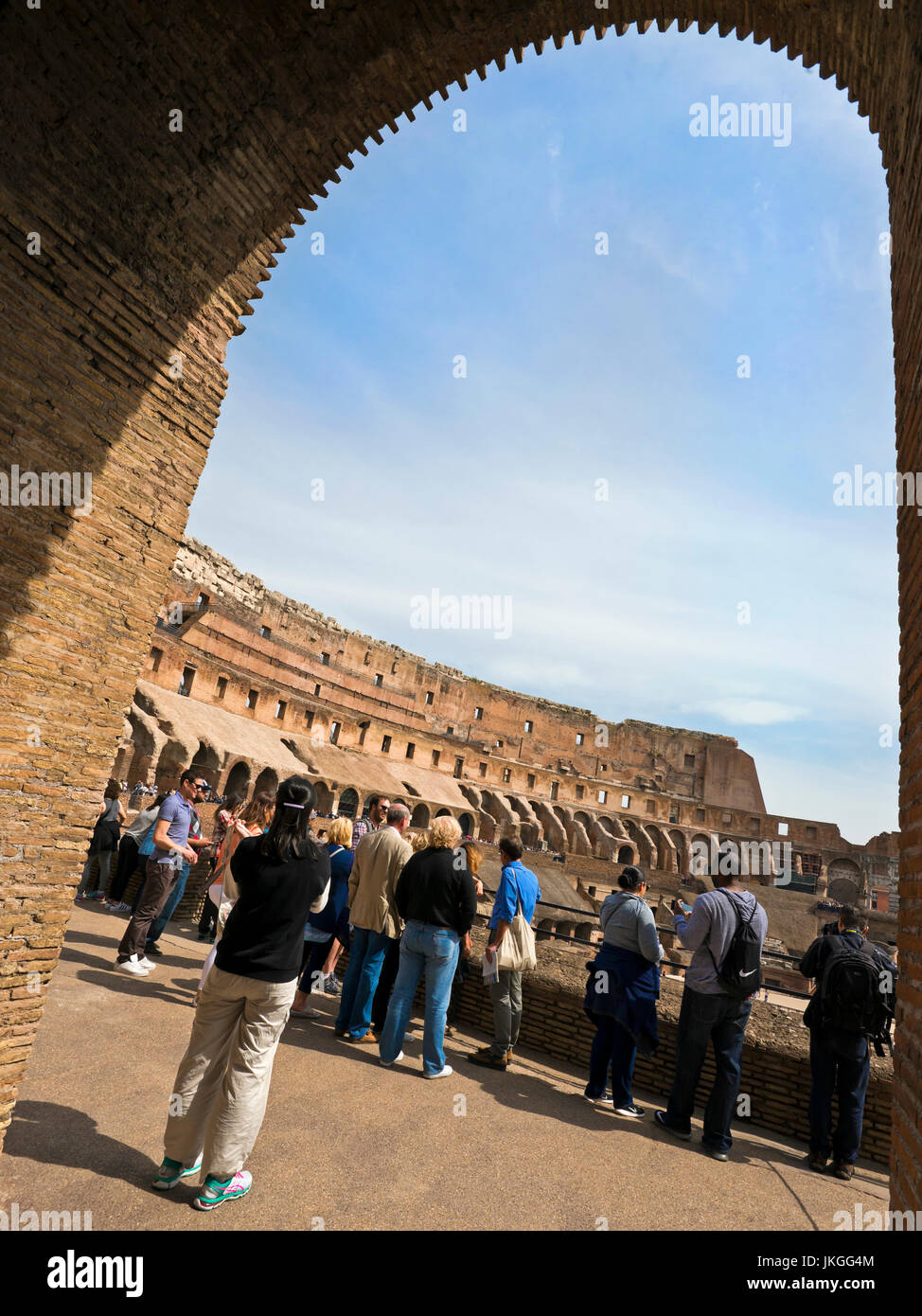 Vertical view through an arch inside the Colosseum in Rome. Stock Photo