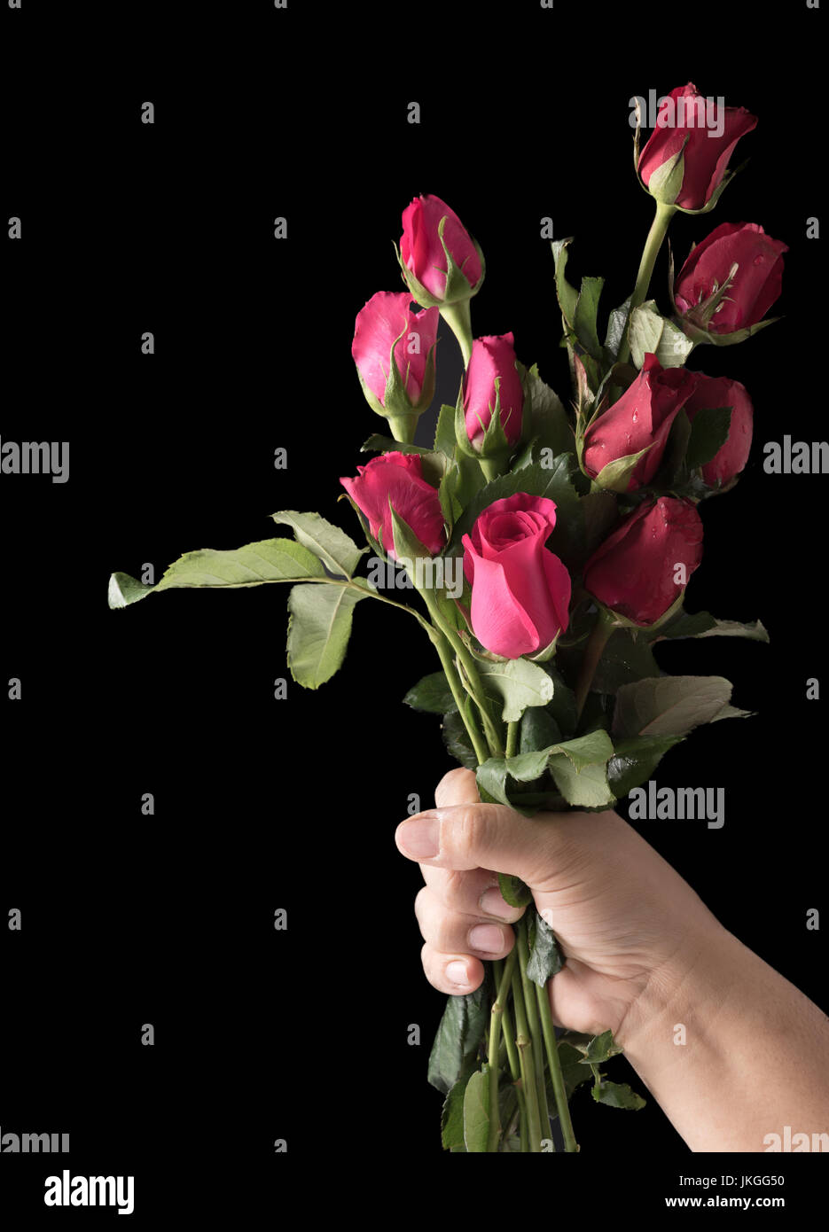 Man giving woman roses dark background hi-res stock photography and images  - Alamy