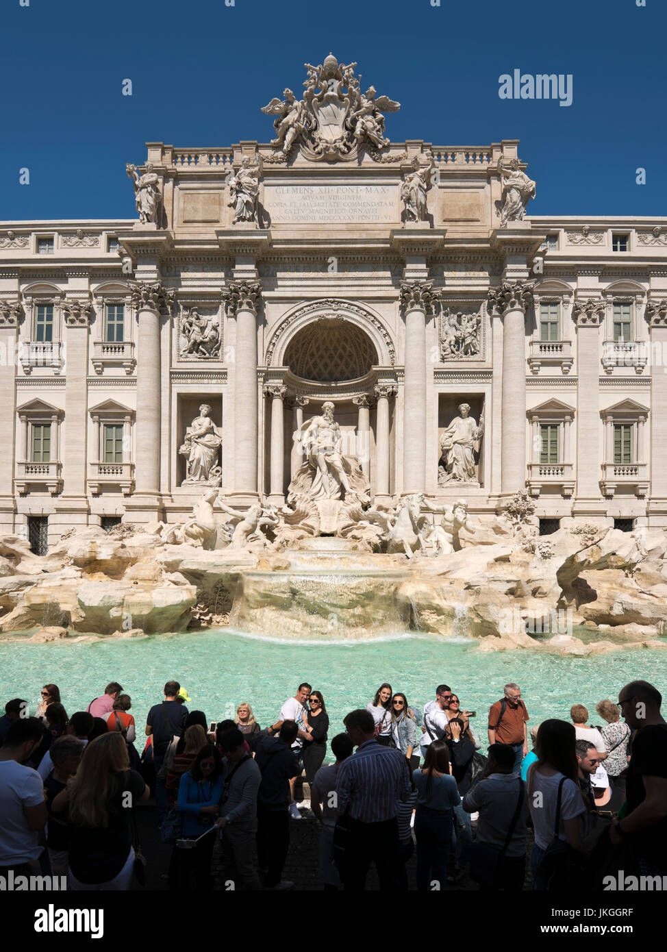 Vertical view of tourists taking photos around the Trevi Fountain in Rome. Stock Photo