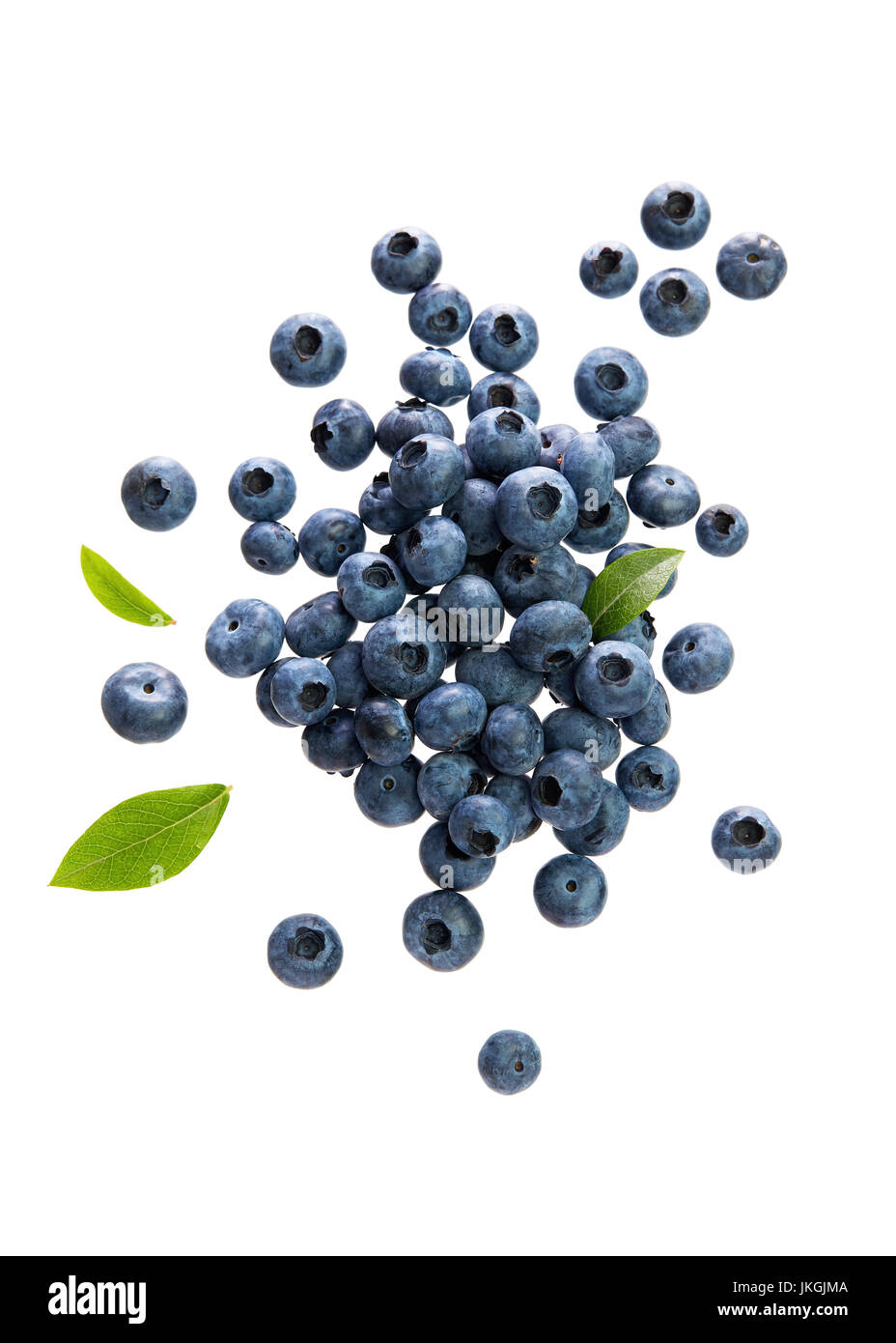 Fresh Blueberries With Leaves on White Background. Scattered blueberries over white background. Stock Photo