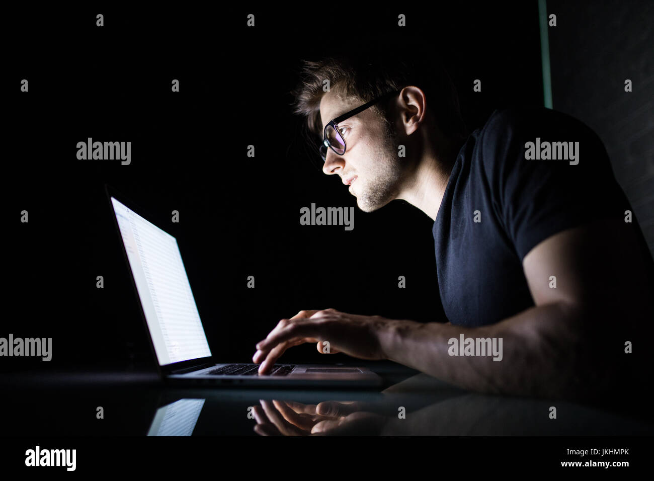 Man sitting computer hacker activity hi-res stock photography and ...