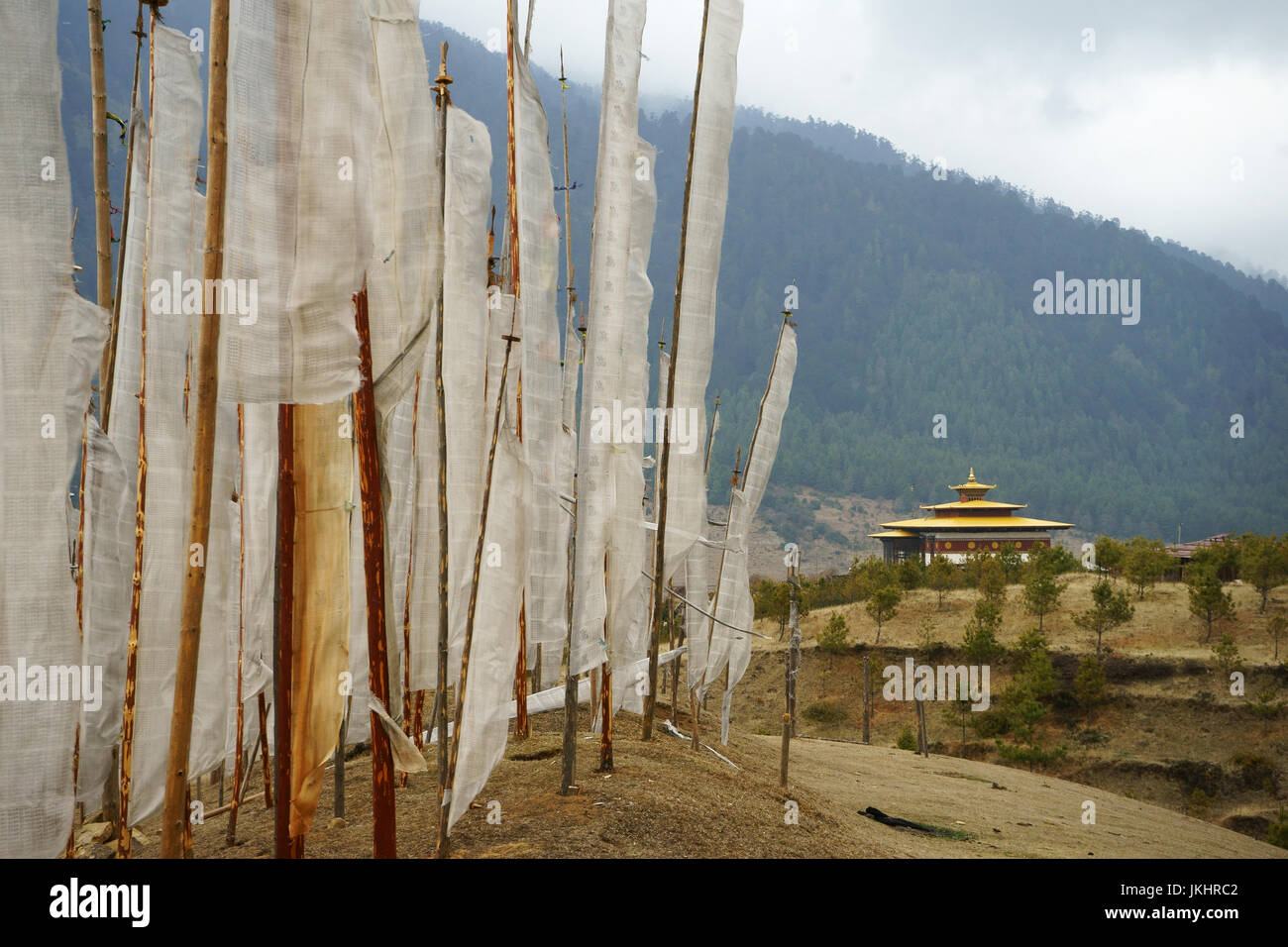 White prayer flags and tmeple, Phobjikha valley, Bhutan Stock Photo