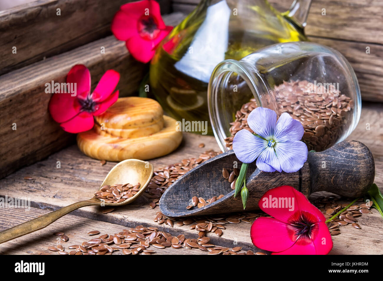 Flax seeds,flax flowers red and blue on a wooden retro background Stock