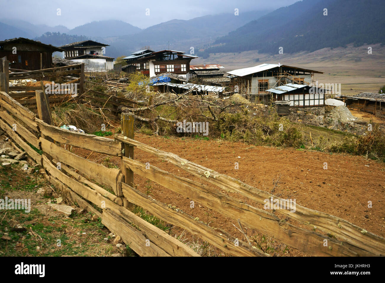 Farmhouses with wooden fences, Phobjikha valley, Bhutan Stock Photo