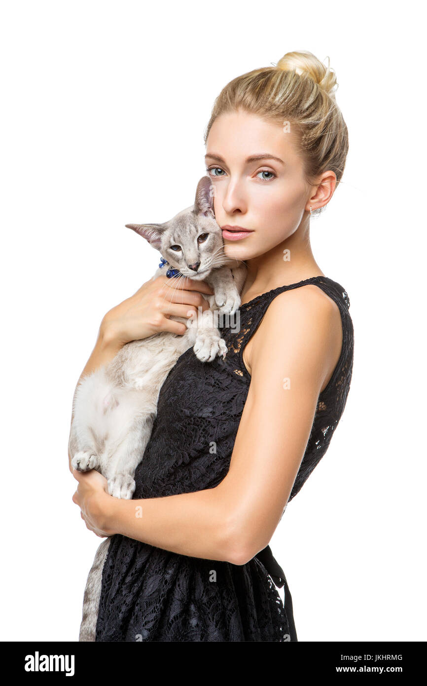 Beautiful blond girl with oriental siam cat isolated on white ...