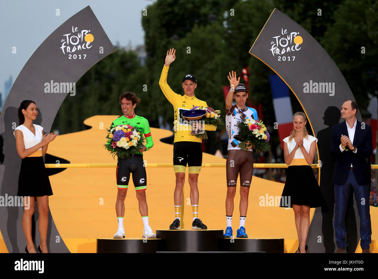 Team Sky's Chris Froome (centre) celebrates on the podium next to second place Cannondale's Rigoberto Uran (left) and third place AG2R La Mondiale's Romain Bardet (right) during stage 21 of the Tour de France in Paris, France. Stock Photo