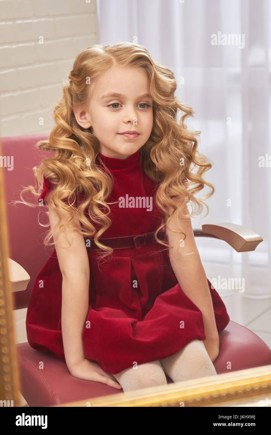 Little girl with beautiful hair. Stock Photo