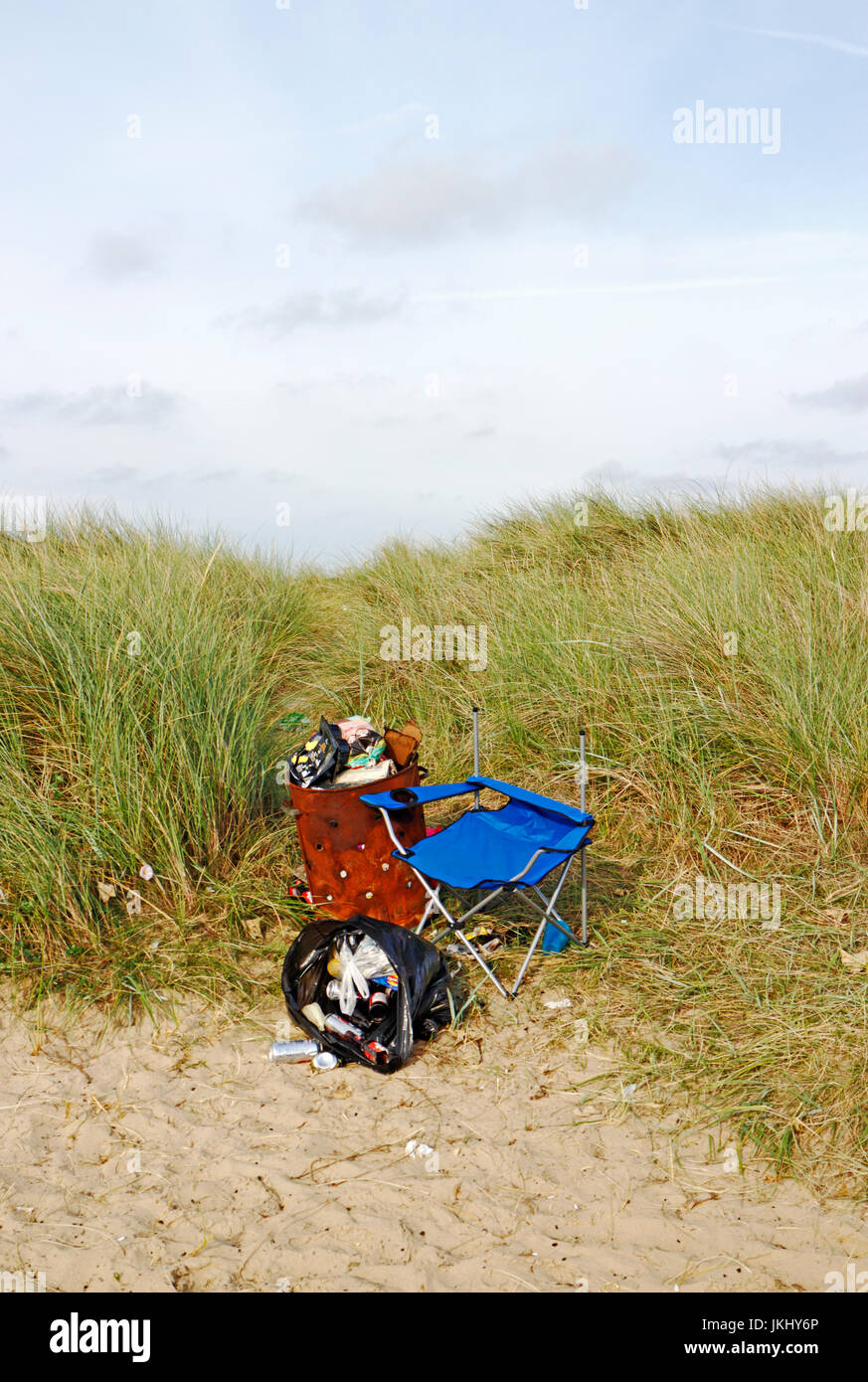 Rubbish collected and bagged and left in sand dunes after a BBQ on the Norfolk coast. Stock Photo